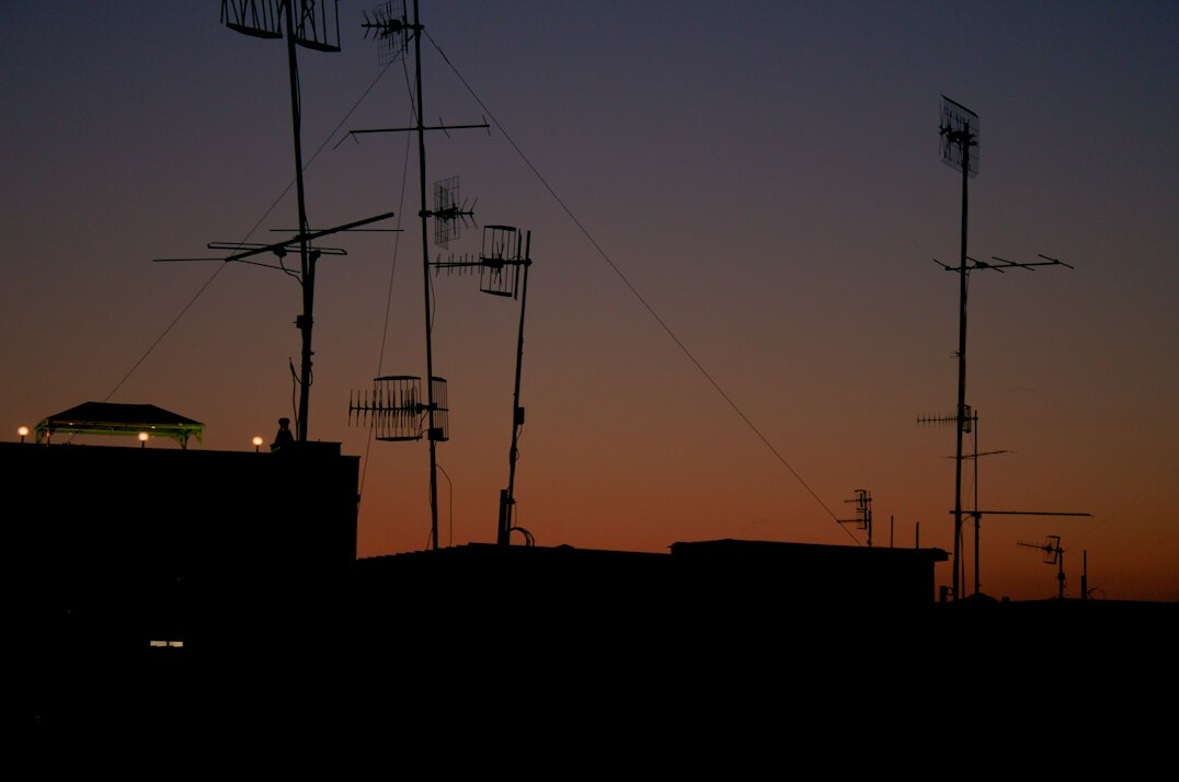 Broadcast engineer monitoring live signal feeds
