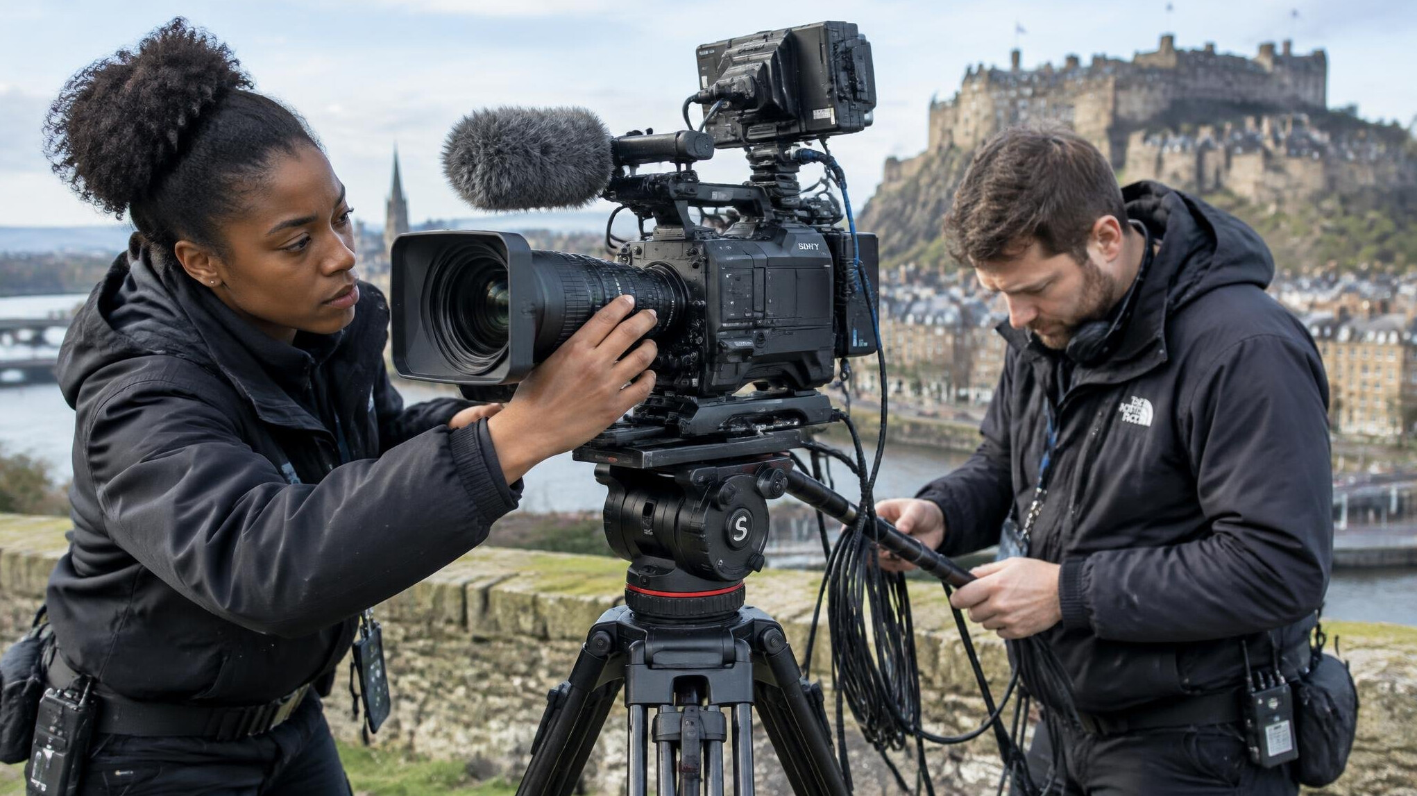 Camera crew setting up broadcast equipment