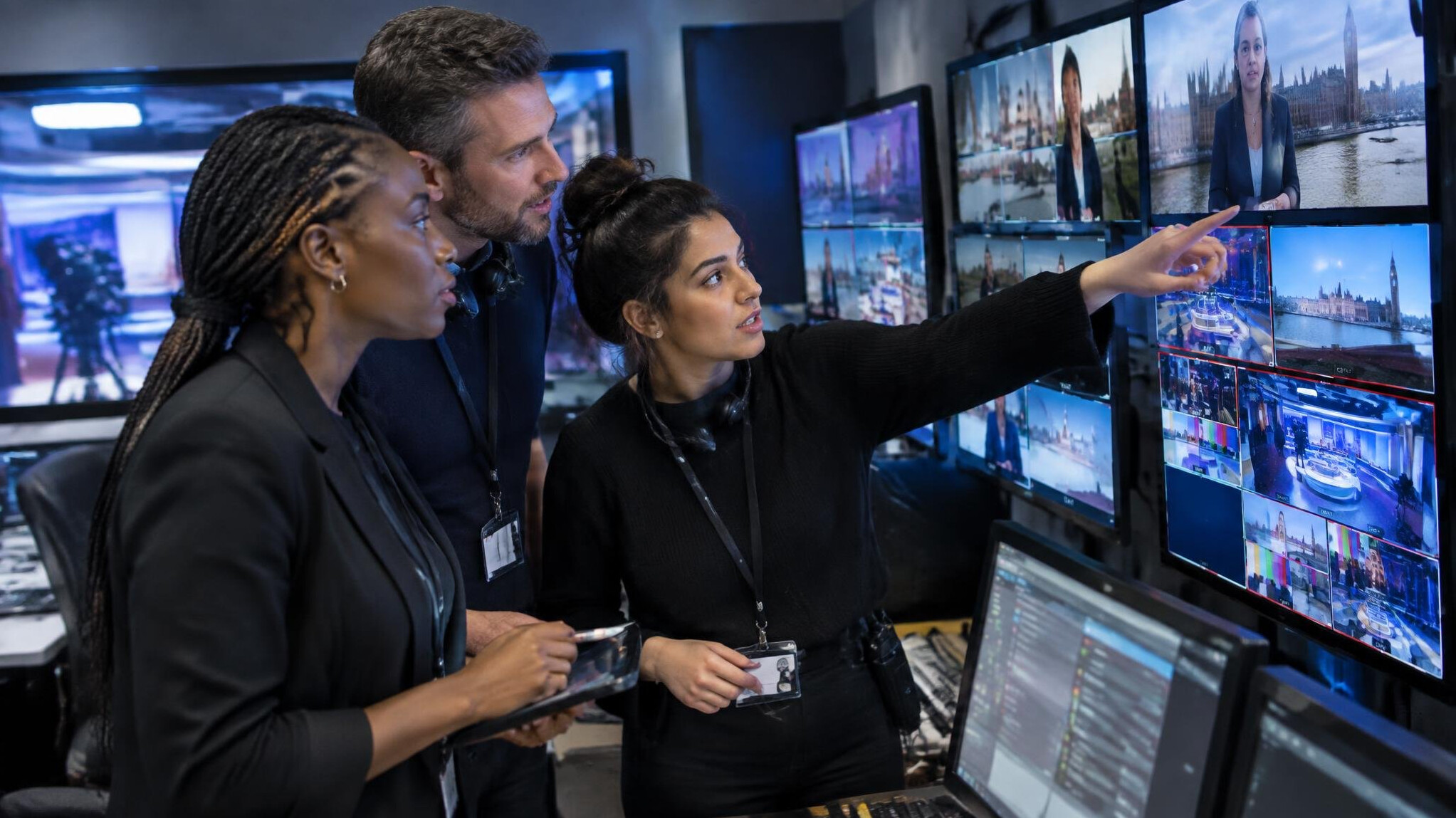 Team reviewing a live broadcast feed on screens